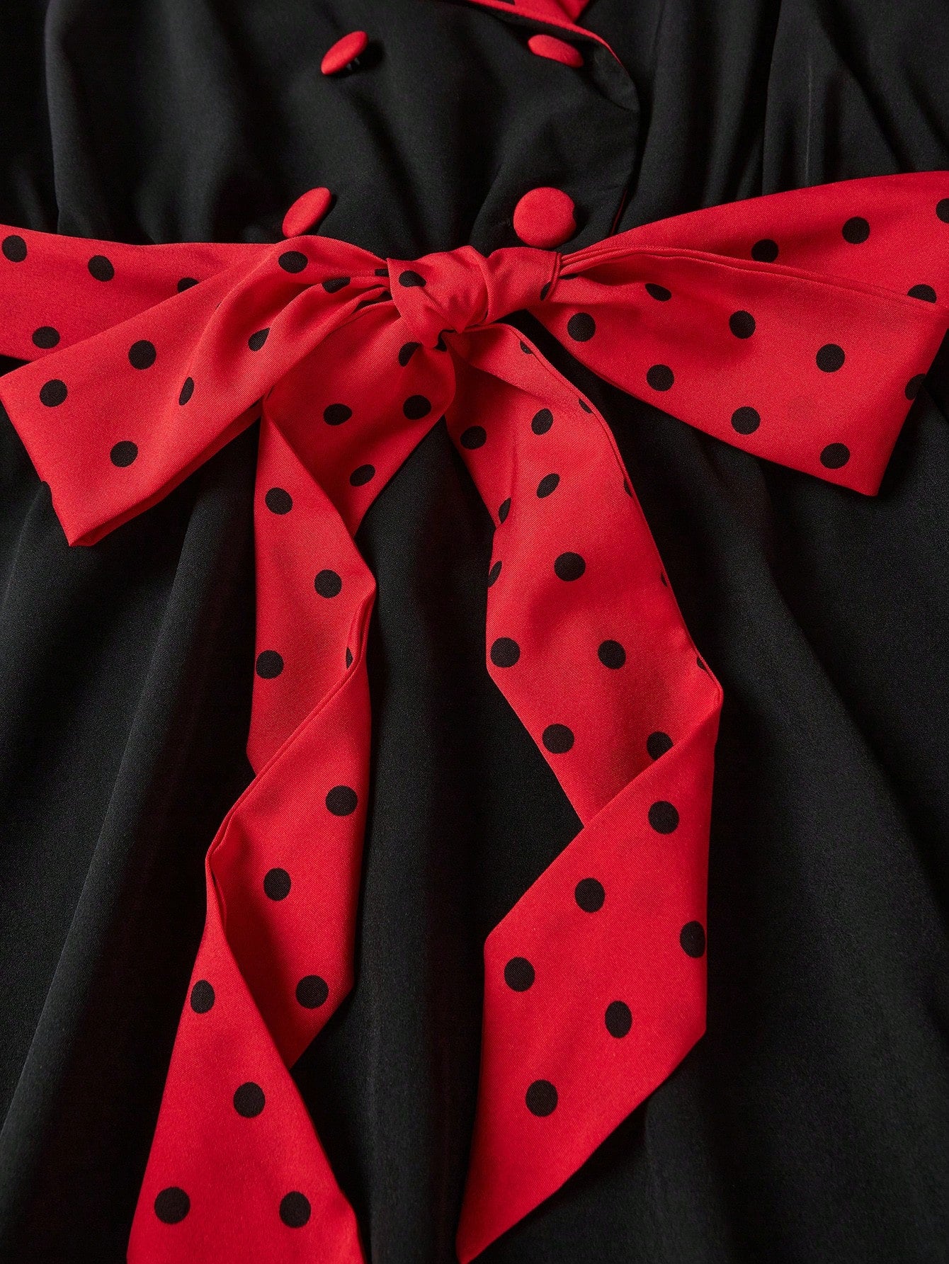 "Close-up detail of Queen's Gambit dress pattern and fabric texture"
"Side view of vintage-style Queen's Gambit dress showing fit and flare design"
