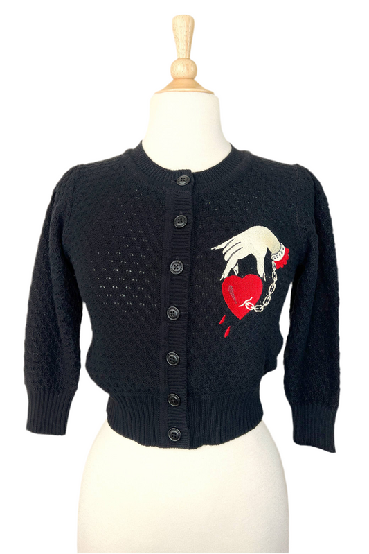 Black cropped cardigan with embroidered captive heart and hand chain design