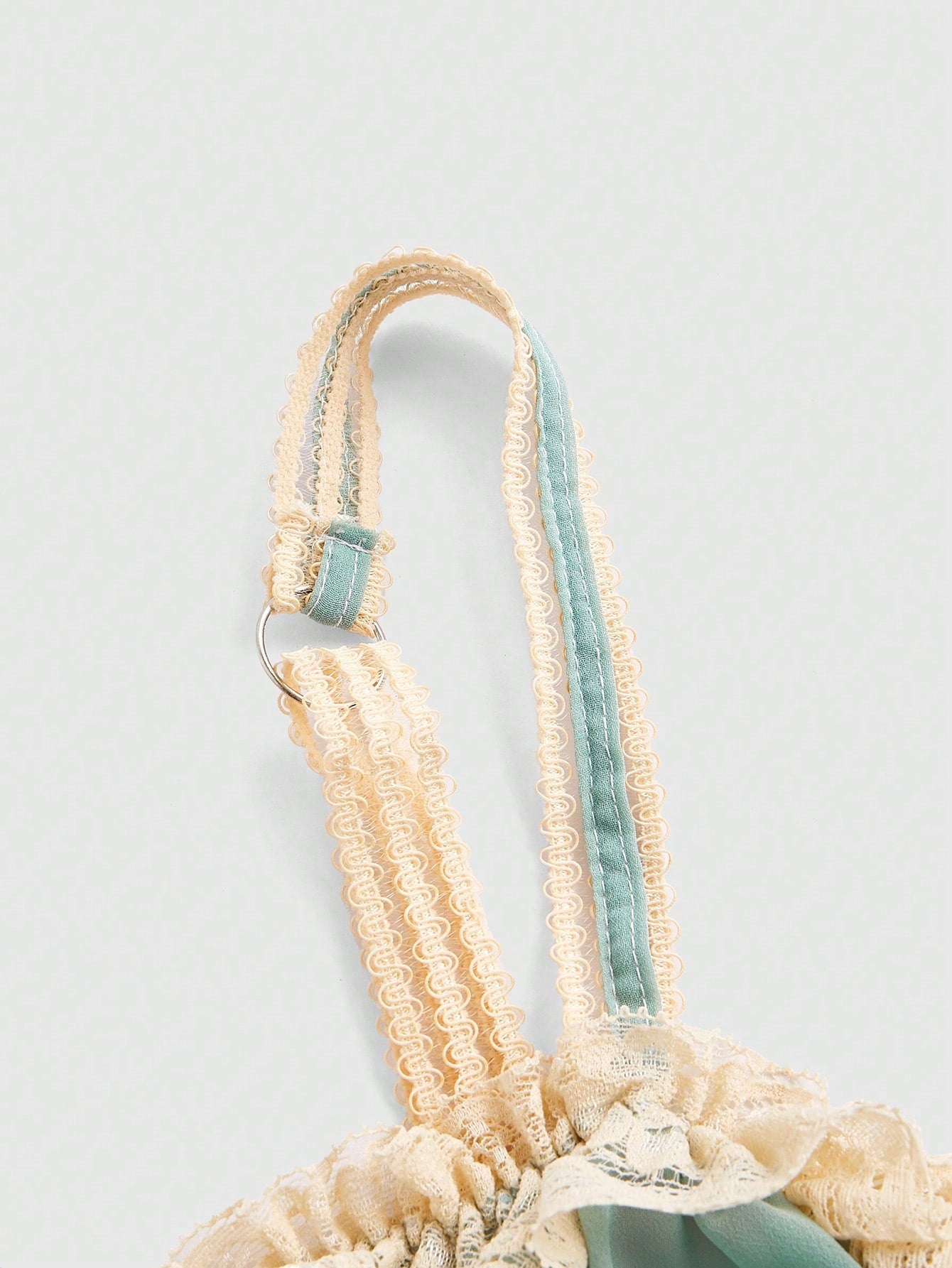 Detail shot of high-quality fabric and delicate lace trim