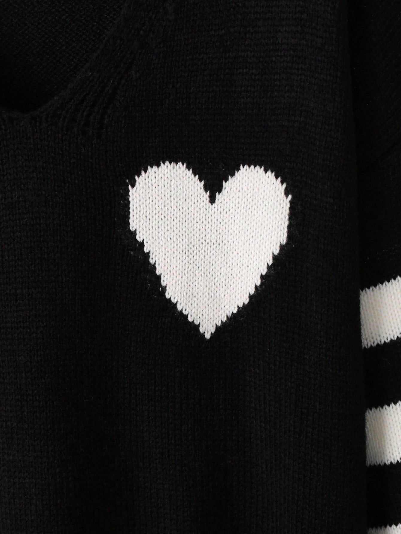 Alternative black sweater with white hearts - cozy fashion featuring long sleeves and inclusive sizing S-5XL