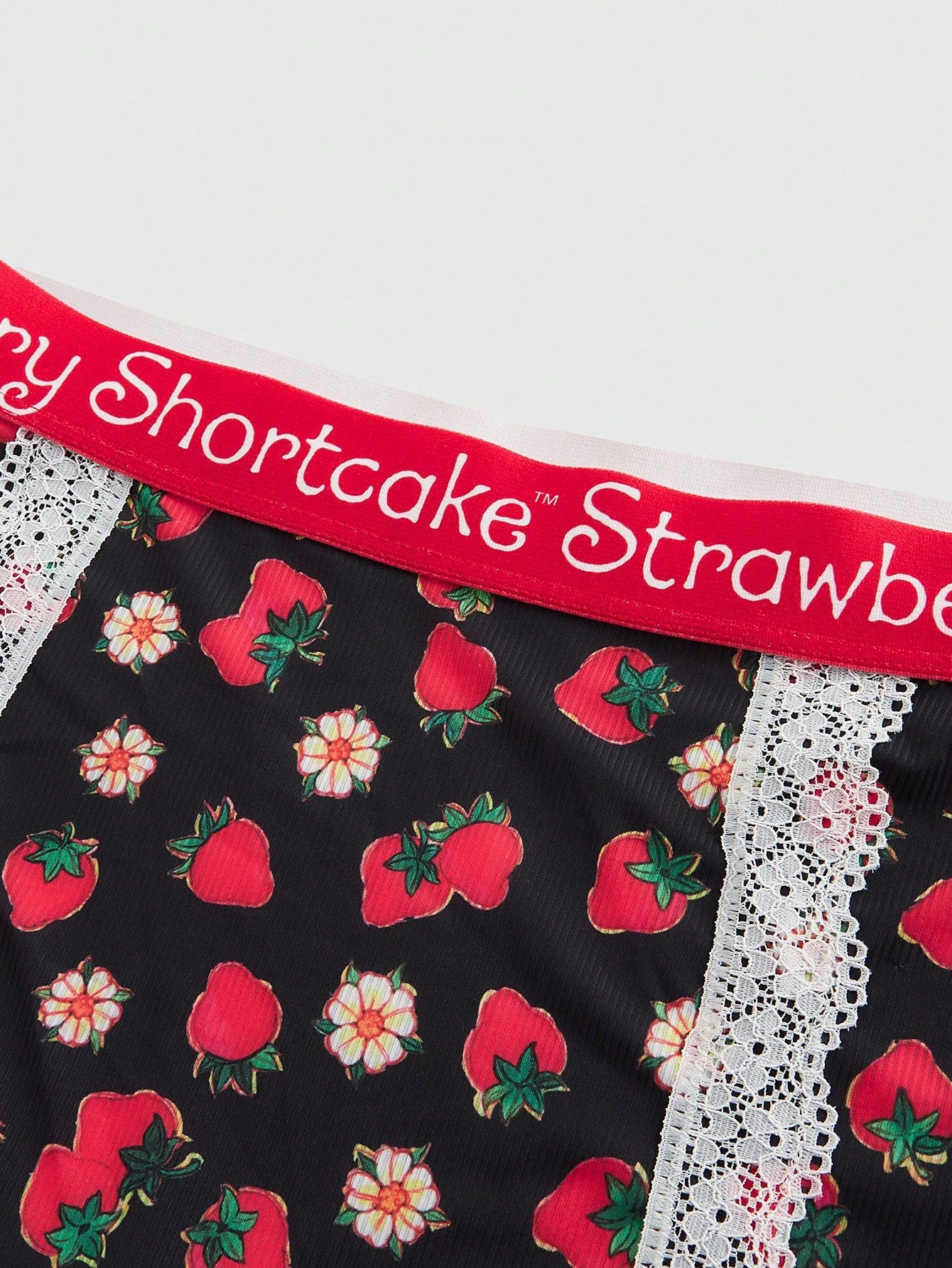 Close-up detail of high-quality fabric and strawberry print pattern