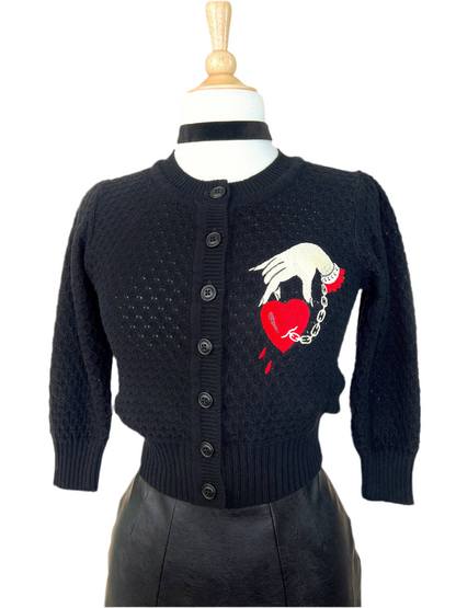 Black cropped cardigan with embroidered captive heart and hand chain design