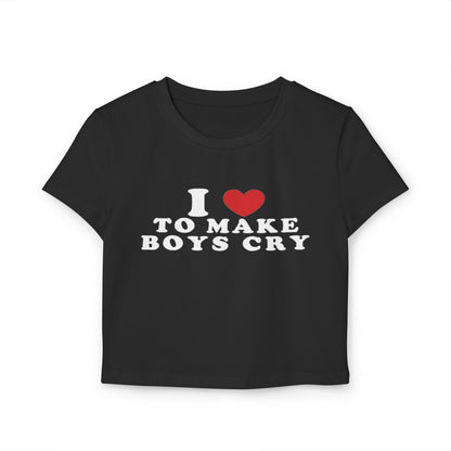 "Empowering fitted baby tee with 'I Love to Make Boys Cry' statement design, shown in black on size-inclusive model"
