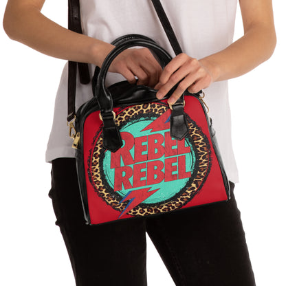 Rebel Rebel gothic handbag with floral motif
Alternative fashion gothic purse with rebellious design
Edgy punk rock handbag in gothic floral print