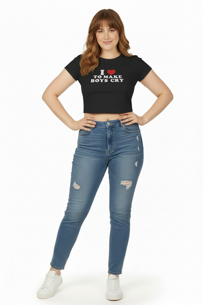Woman wearing a black t-shirt with text and blue jeans on a white background
