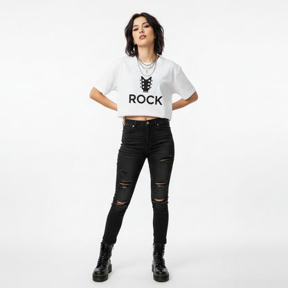 Woman wearing a white t-shirt with 'ROCK' text and black ripped jeans on a white background