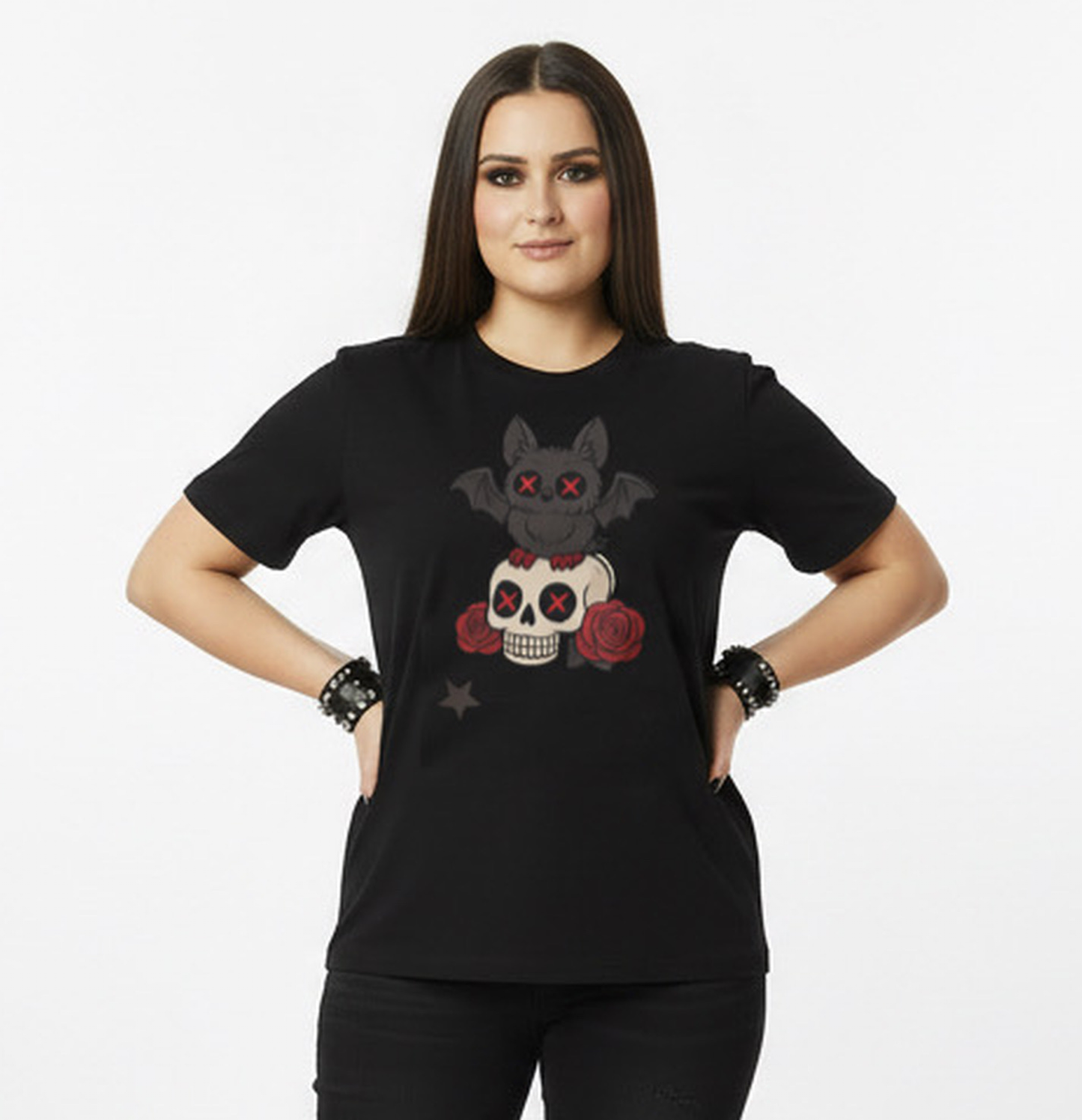 Woman wearing a black t-shirt with a graphic goth bat design on a white background