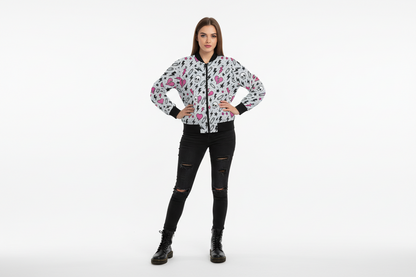 Woman wearing a floral jacket and black pants on a white background