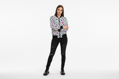 Woman wearing a patterned jacket and black pants on a white background
