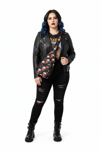 Person wearing a black leather jacket, graphic t-shirt, ripped jeans, and black knee-high boots on a white background