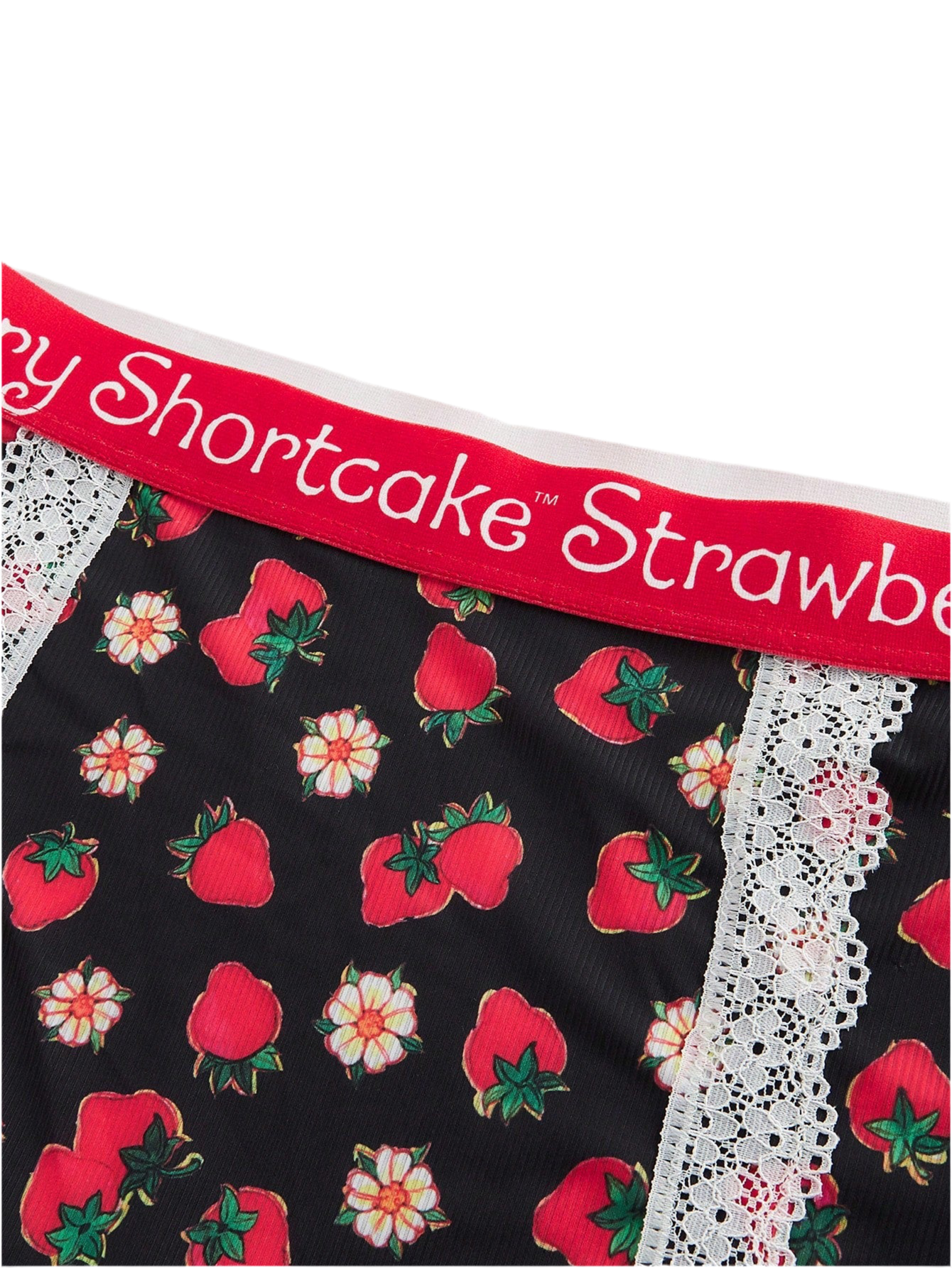 Loungewear top close-up showing detailed strawberry print pattern and fabric texture