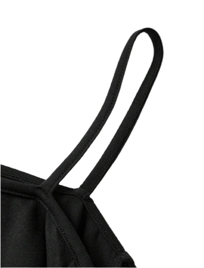 Off-shoulder black sweatshirt with white skull-and-tree design
