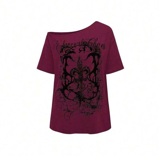 Deep wine off-shoulder tee with black distressed “Embrace the Chaos” print.
