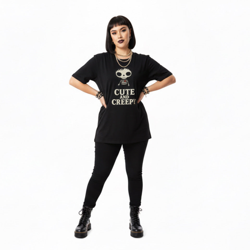 Person wearing a black t-shirt with 'Cute and Creepy' text and skull design on a white background