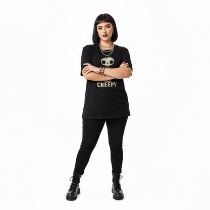 Person wearing a black t-shirt with text and graphics on a white background