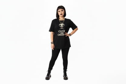 Person wearing a black t-shirt with text and graphics on a white background