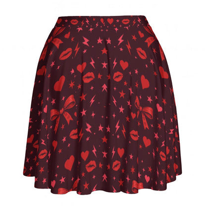 High-waisted skater skirt in deep cherry red with hearts, lips, bows, stars and lightning print, front view.