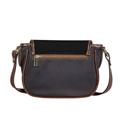 Back view of saddle crossbody bag showing dark body, brown trim, and back zipper pocket.