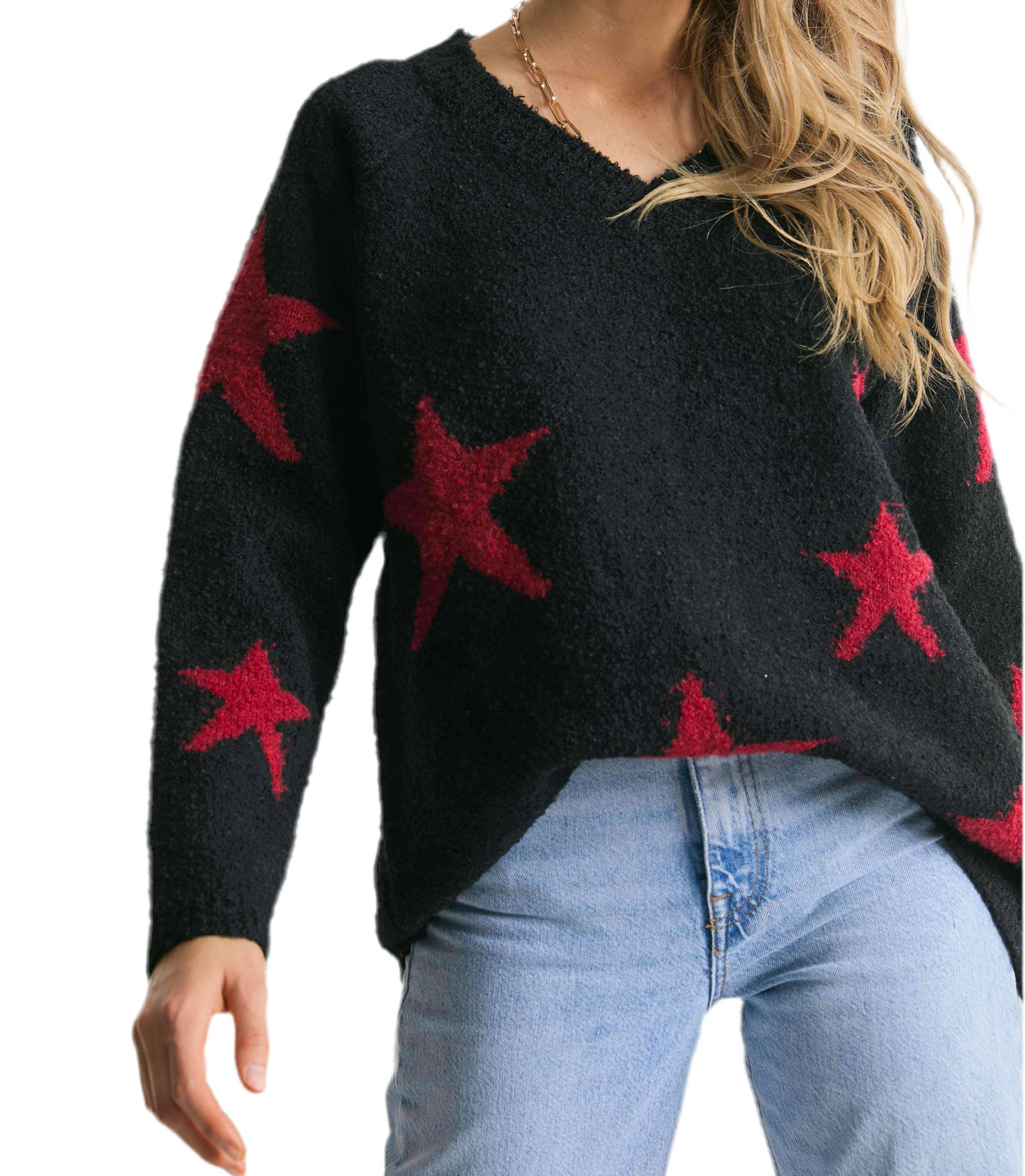 Black sweater with red star patterns worn by a person on a white background