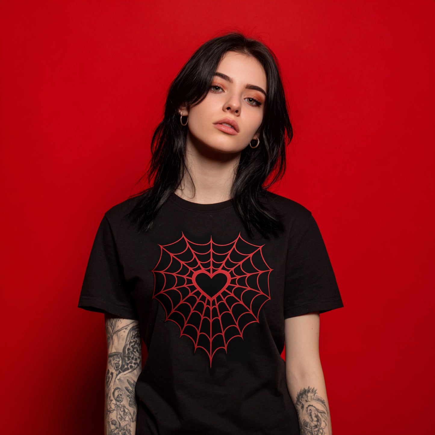 Black gothic t-shirt with red spider-webbed heart graphic
